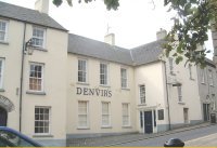 Denvirs Hotel:It is not known precisely when the hotel was built but in 1642 it was in the possession of John and Ann Macgreevy. John had been  a soldier in the army of Charles I and accepted it as part recompense for non-payment of wages. It was a centre for the United Irishmen in the 1790s.

A coaching inn from the early 1800s, it has been the centre of social activity in the town ever since, apart from a brief period in the early 1820s. A recent renovation has revealed evidence of a seventeenth century structure.

On his reform programme, Daniel O'Connell addressed a large crowd from one of its upstairs windows. There is a tradition the cobbled area in front of the hotel, behind the line of the footpath, was a debtor's sanctuary.
Photo Pat Devlin

CLICK FOR LARGER PICTURE